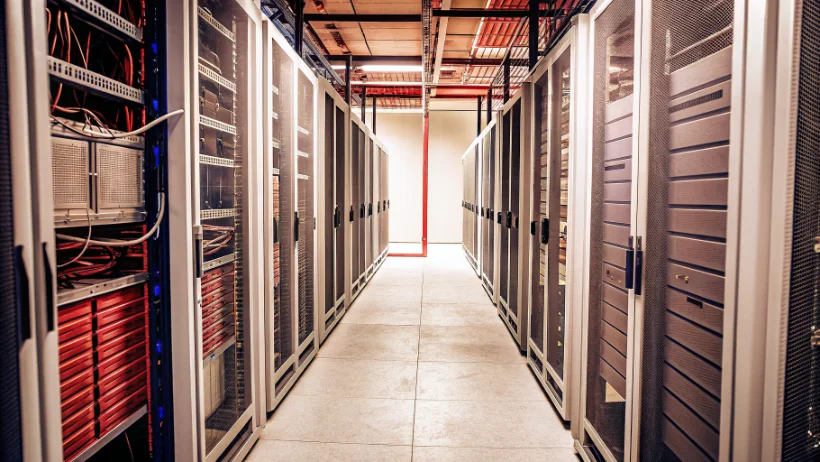 High-performance server racks with fiber optic networking equipment in data centre facility